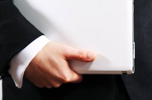 9281-businessman-holding-a-white-laptop-pv